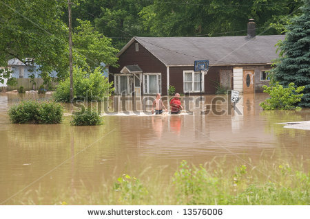 stock-photo-two-men-wade-through-flood-w
