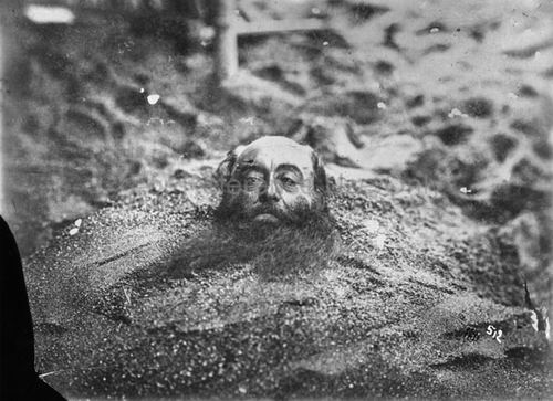 Man being buried alive, 1870s - 1930s.jpg