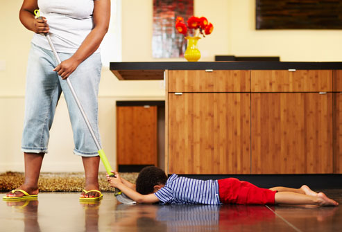 getty_rf_photo_of_mother_sweeping_child_
