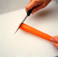 Cut off ends of carrot with paring knife.