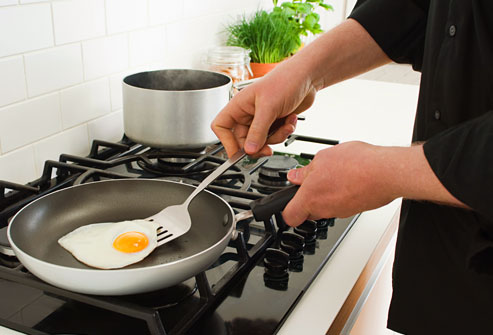 getty_rf_photo_of_man_cooking_egg_in_tef