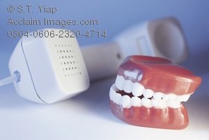 Poster Print of Phone Handset and Toy Denture