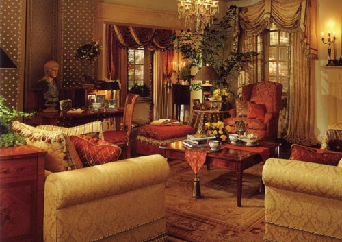 Very-beautiful-living-room-with-beige-sofas-red-armchair-red-stool-wooden-glass-coffee-table-Persian-carpet-pictures-and-statue